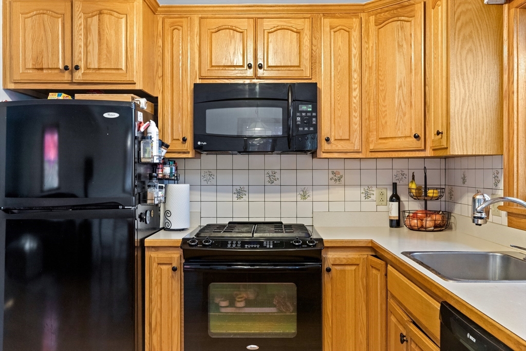 6 Auburn Road Salem, MA 01970 - Photo 11 of 32 a kitchen with granite countertop a stove and a sink