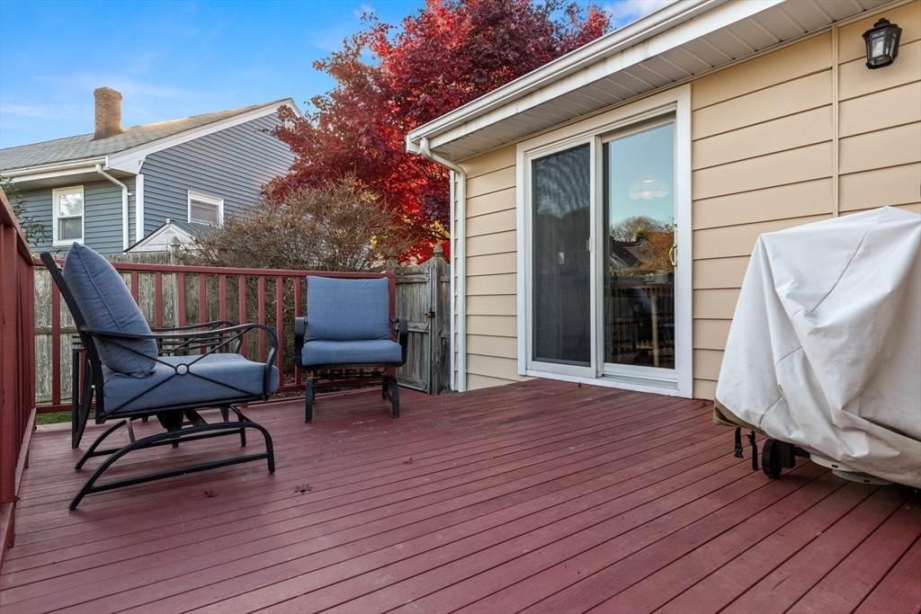 6 Auburn Road Salem, MA 01970 - Photo 15 of 32 a balcony with wooden floor table and chairs