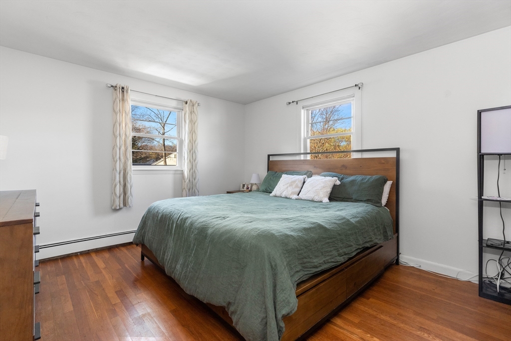 6 Auburn Road Salem, MA 01970 - Photo 19 of 32 a bedroom with a bed and wooden floor