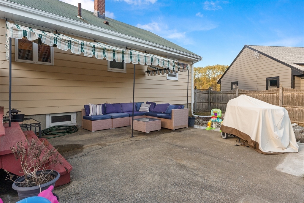 6 Auburn Road Salem, MA 01970 - Photo 29 of 32 a view of a house with a backyard and a couch