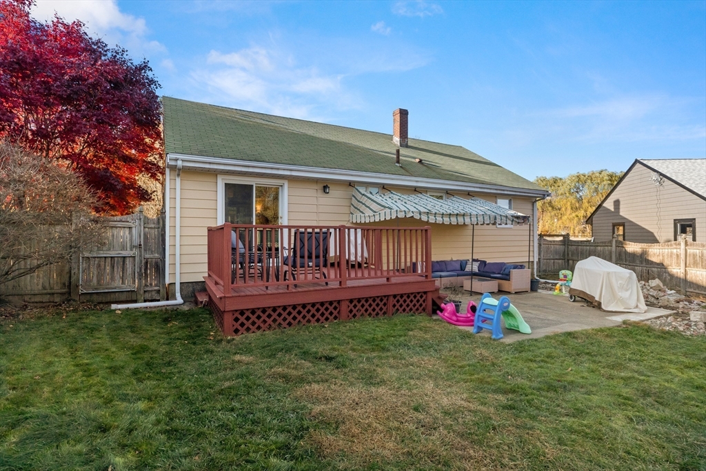 6 Auburn Road Salem, MA 01970 - Photo 4 of 32 a view of a backyard with a small cabin and a wooden deck