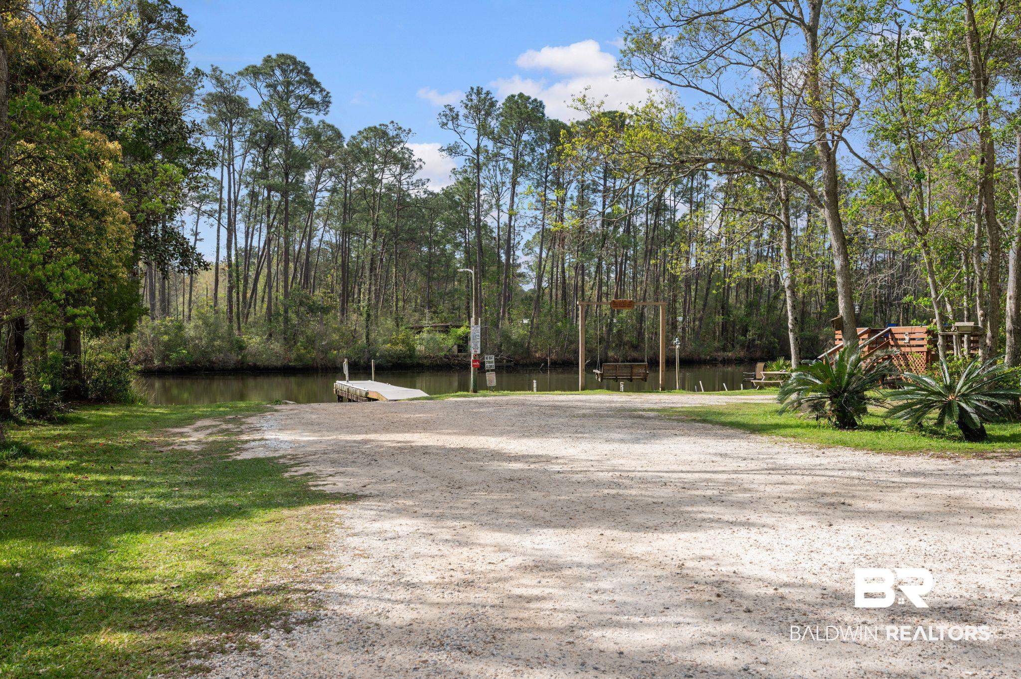 24711 County Road 20, Unit A11 Elberta, AL 36530 - Photo 30 of 35 View of street featuring a boat ramp and a water view