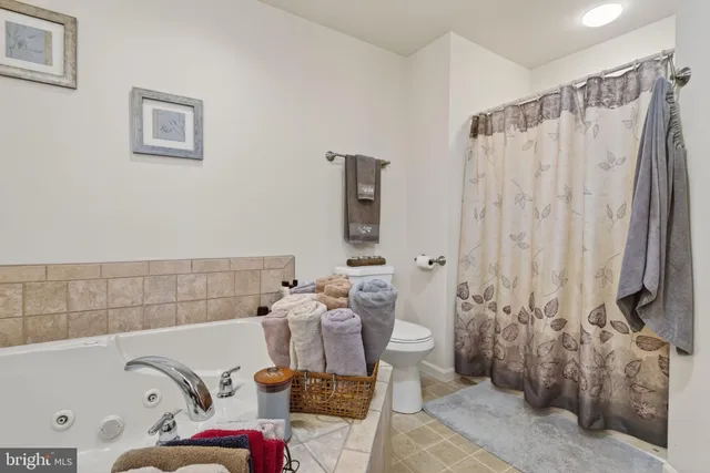 a bathroom with a bathtub and shower