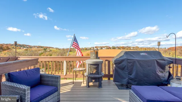 a view of balcony with furniture and wooden floor