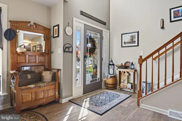 a living room with furniture and a rug