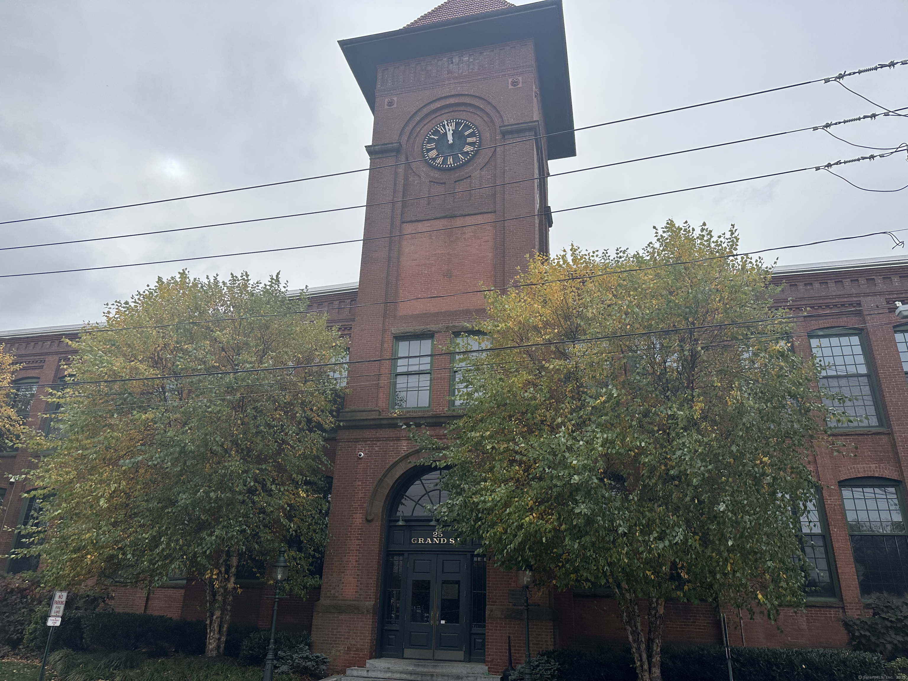 a view of a building with a tree
