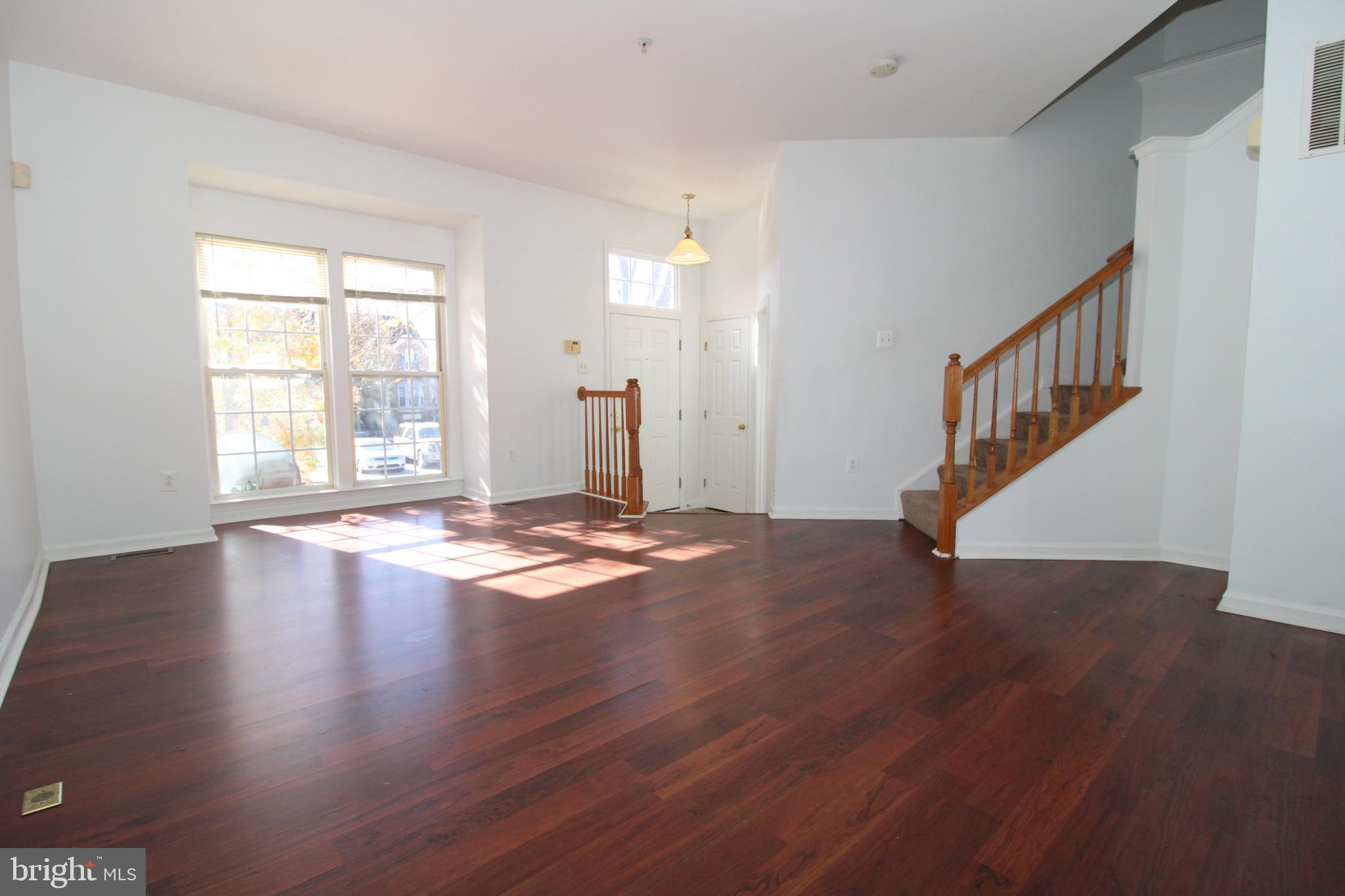 17628 Basalt Way Hagerstown, MD 21740 - Photo 2 of 20 a view of empty room with wooden floor and fan