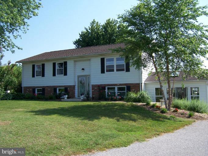 a view of a yard in front of a brick house