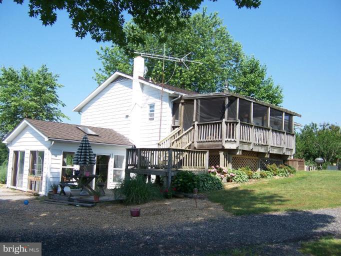 6843 Old Solomons Island Road Friendship, MD 20736 - Photo 16 of 20 a front view of a house with a yard