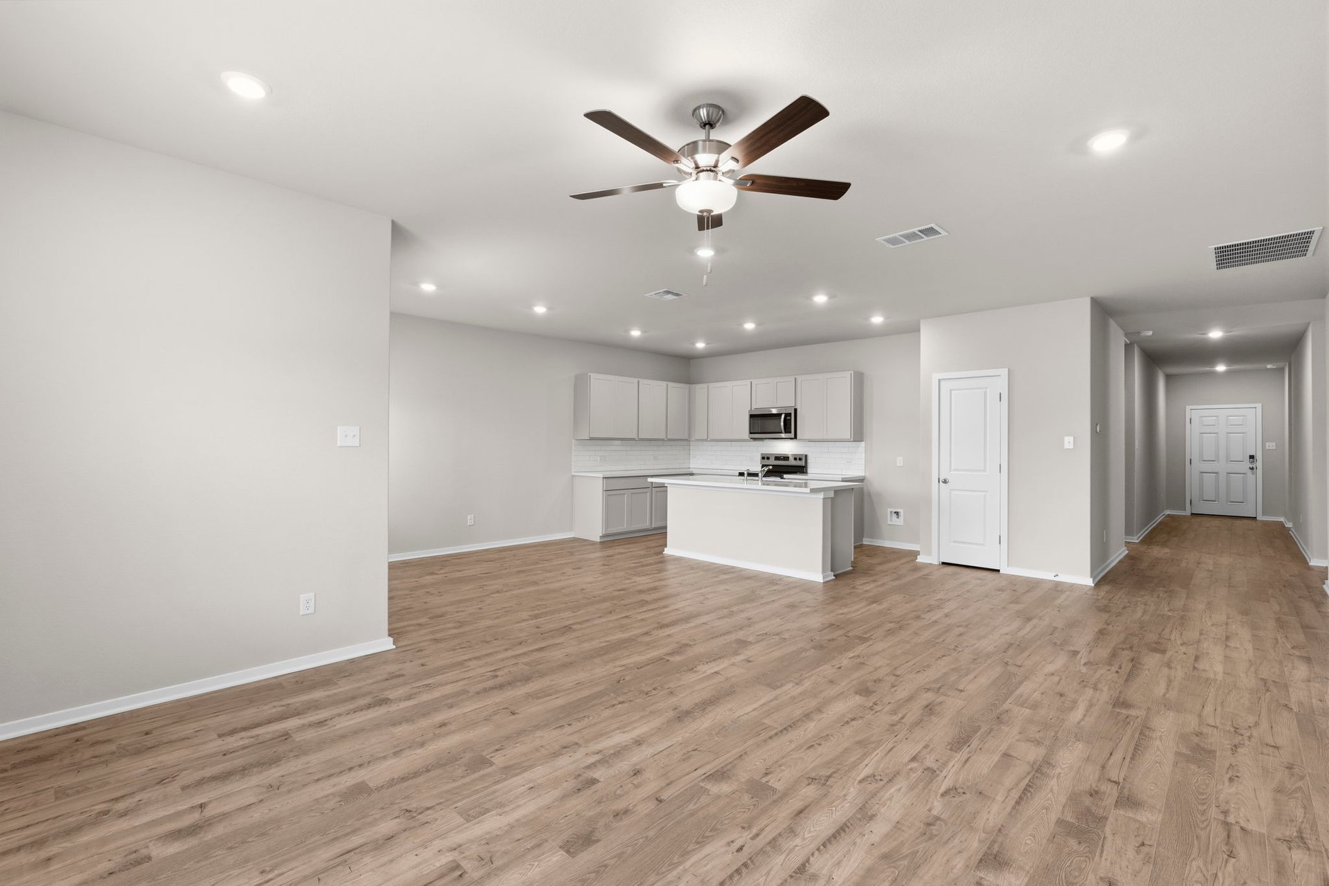 176 Wind Hill Jarrell, TX 76537 - Photo 16 of 31 From Family Room to Open Concept Kitchen