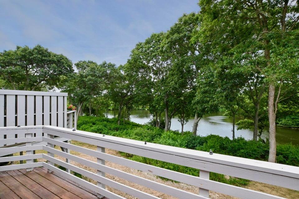 38 Landfall, Unit 38 Falmouth, MA 02540 - Photo 15 of 17 a view of a wooden fence and trees