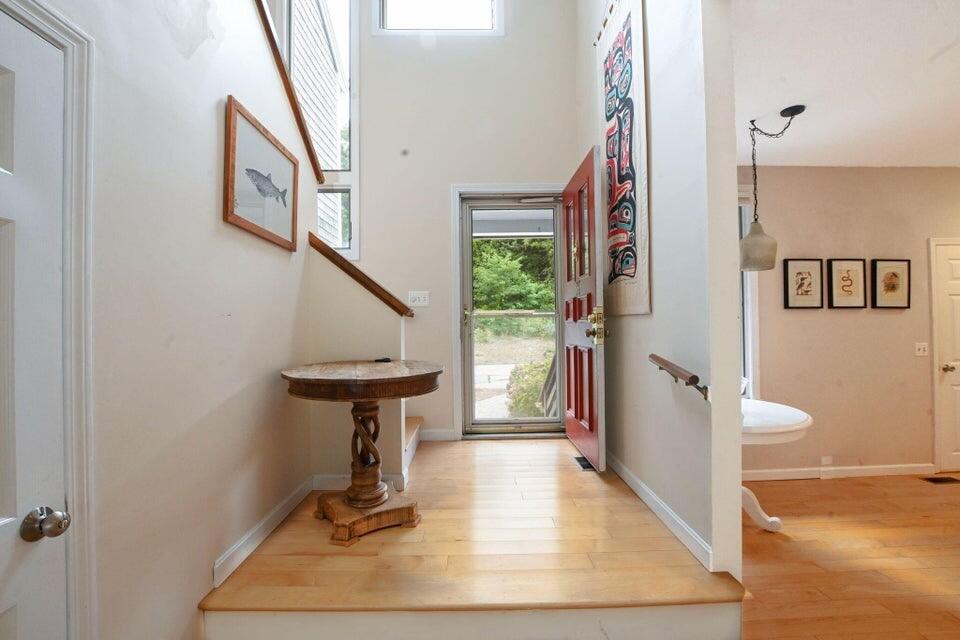 38 Landfall, Unit 38 Falmouth, MA 02540 - Photo 2 of 17 a view of a hallway with wooden floor and staircase