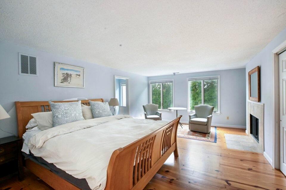 38 Landfall, Unit 38 Falmouth, MA 02540 - Photo 8 of 17 a bed sitting in a bedroom next to a window