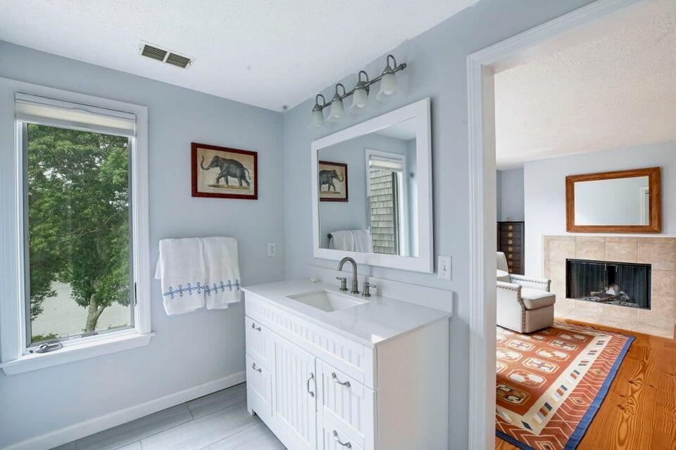 38 Landfall, Unit 38 Falmouth, MA 02540 - Photo 9 of 17 a spacious bathroom with a double vanity sink a mirror and a bathtub
