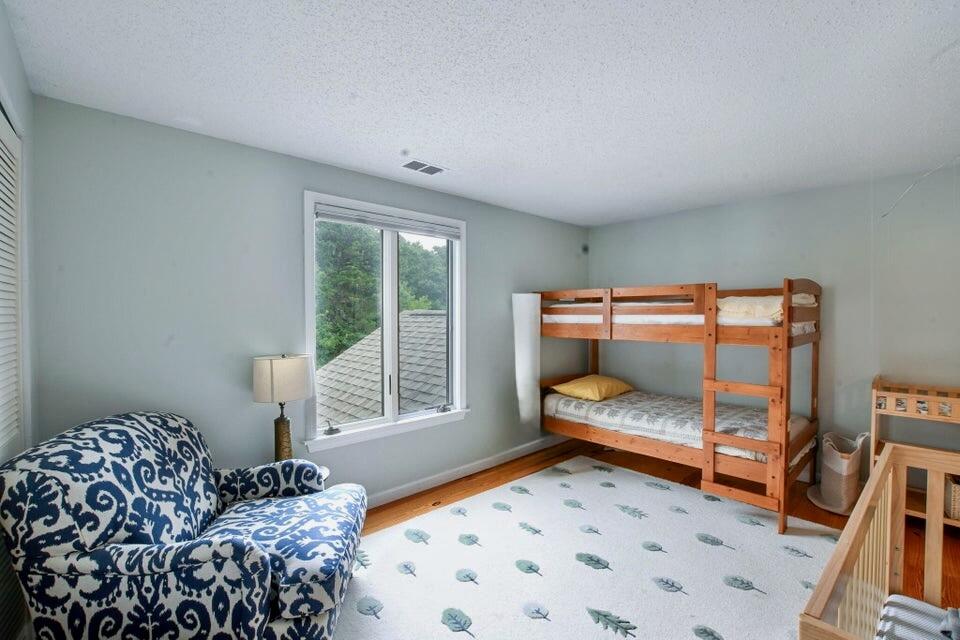 38 Landfall, Unit 38 Falmouth, MA 02540 - Photo 10 of 17 a bedroom with a bed and a window