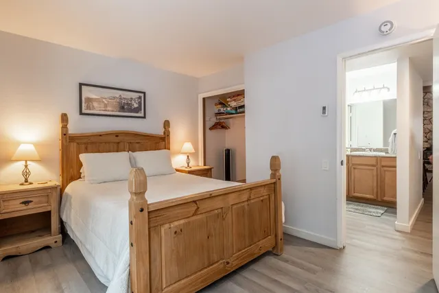 a bed room with a bed and a view