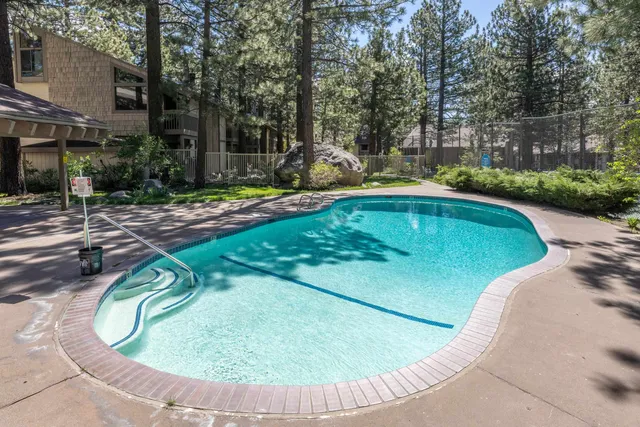 a view of a swimming pool with a patio