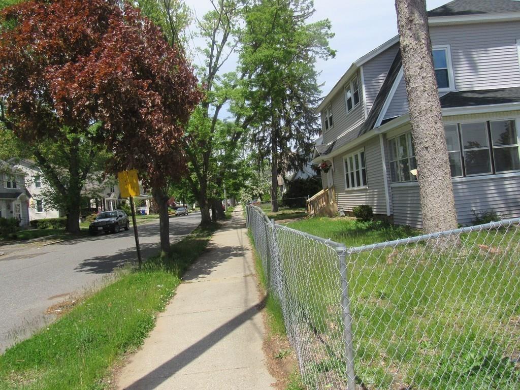 71 Meredith Street Springfield, MA 01108 - Photo 23 of 27 a front view of a house with a yard and fountain