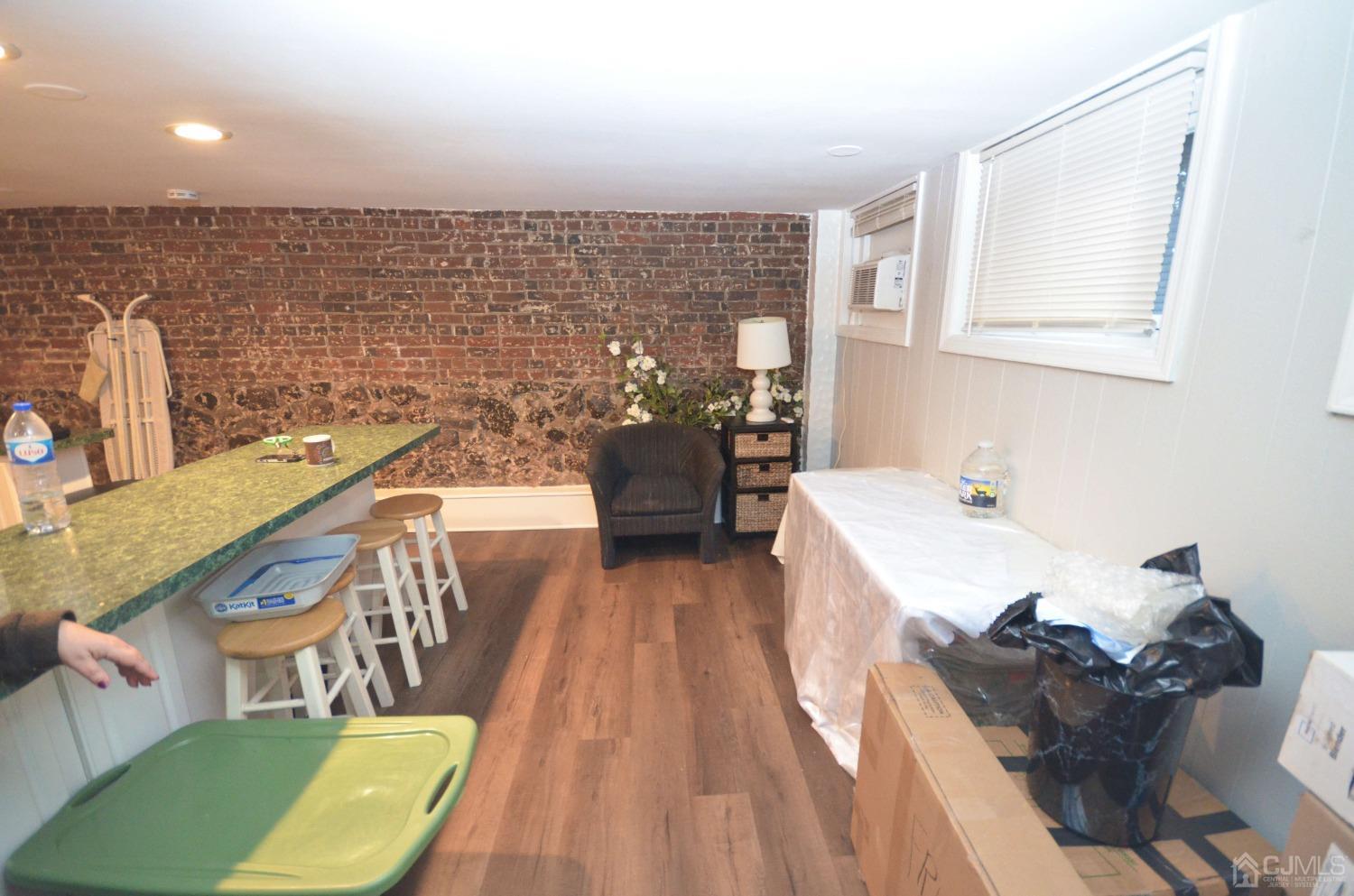 a view of a kitchen with a sink and furniture