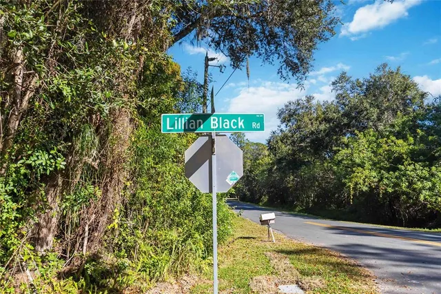 a swimming pool with some trees in the background