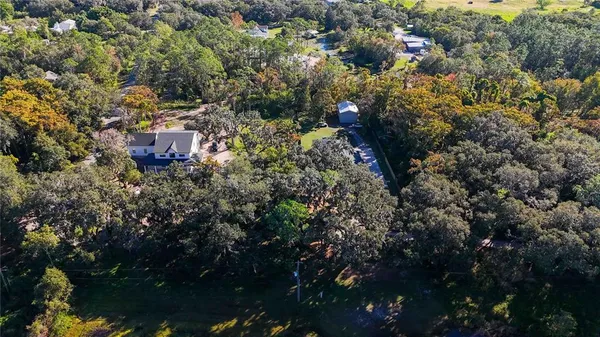 a view of a house with a tree
