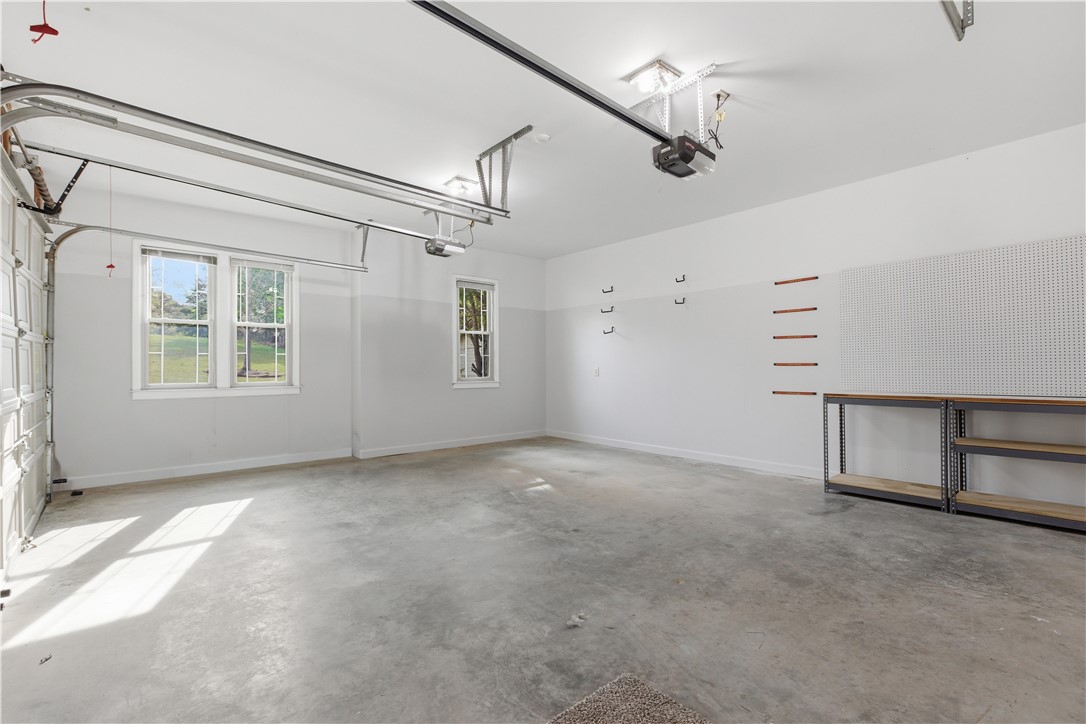 501 Capri Point Lavonia, GA 30553 - Photo 47 of 50 This spacious garage offers abundant natural light and ample storage for all your needs.