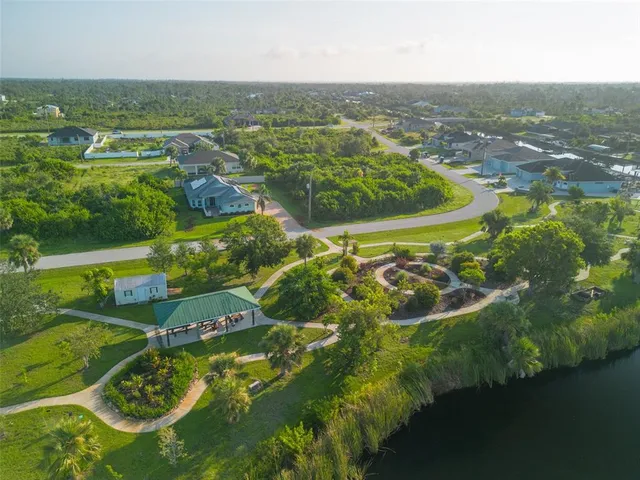 an aerial view of a house with outdoor space swimming pool and ocean view