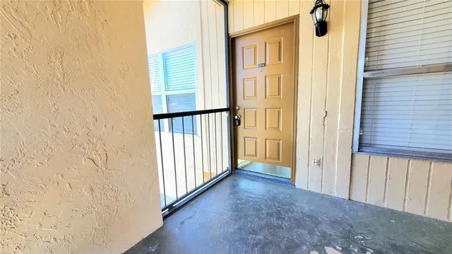 a sign that is sitting on a wooden fence