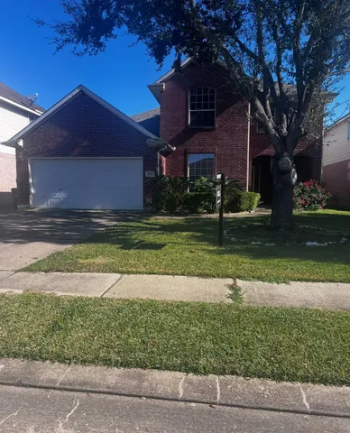 a house view with a garden space