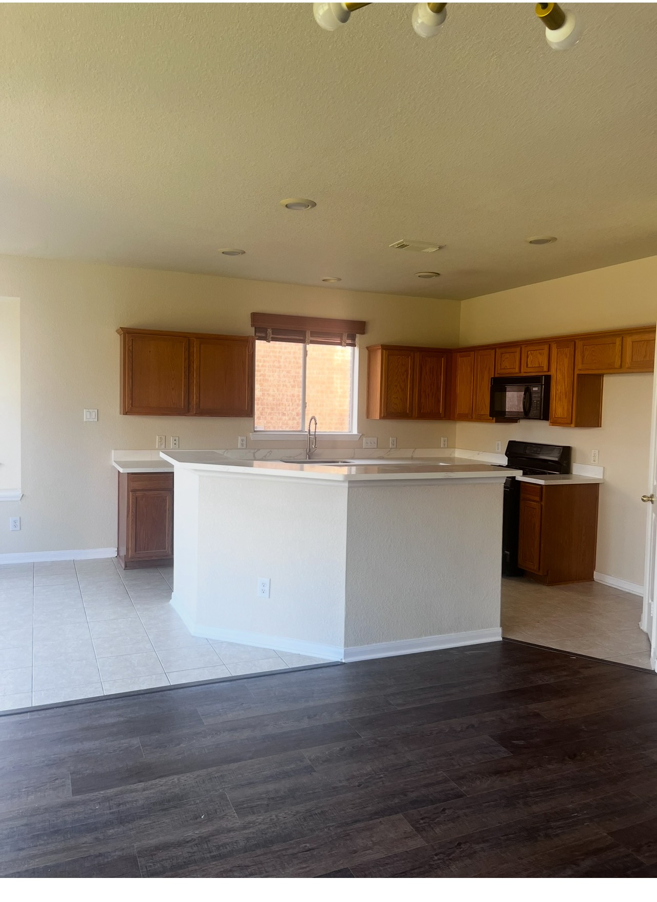 8411 Spotslyvania Lane Houston, TX 77083 - Photo 6 of 8 a view of a kitchen with wooden floor