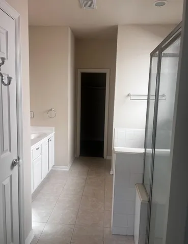 a bathroom with a bathtub and a sink