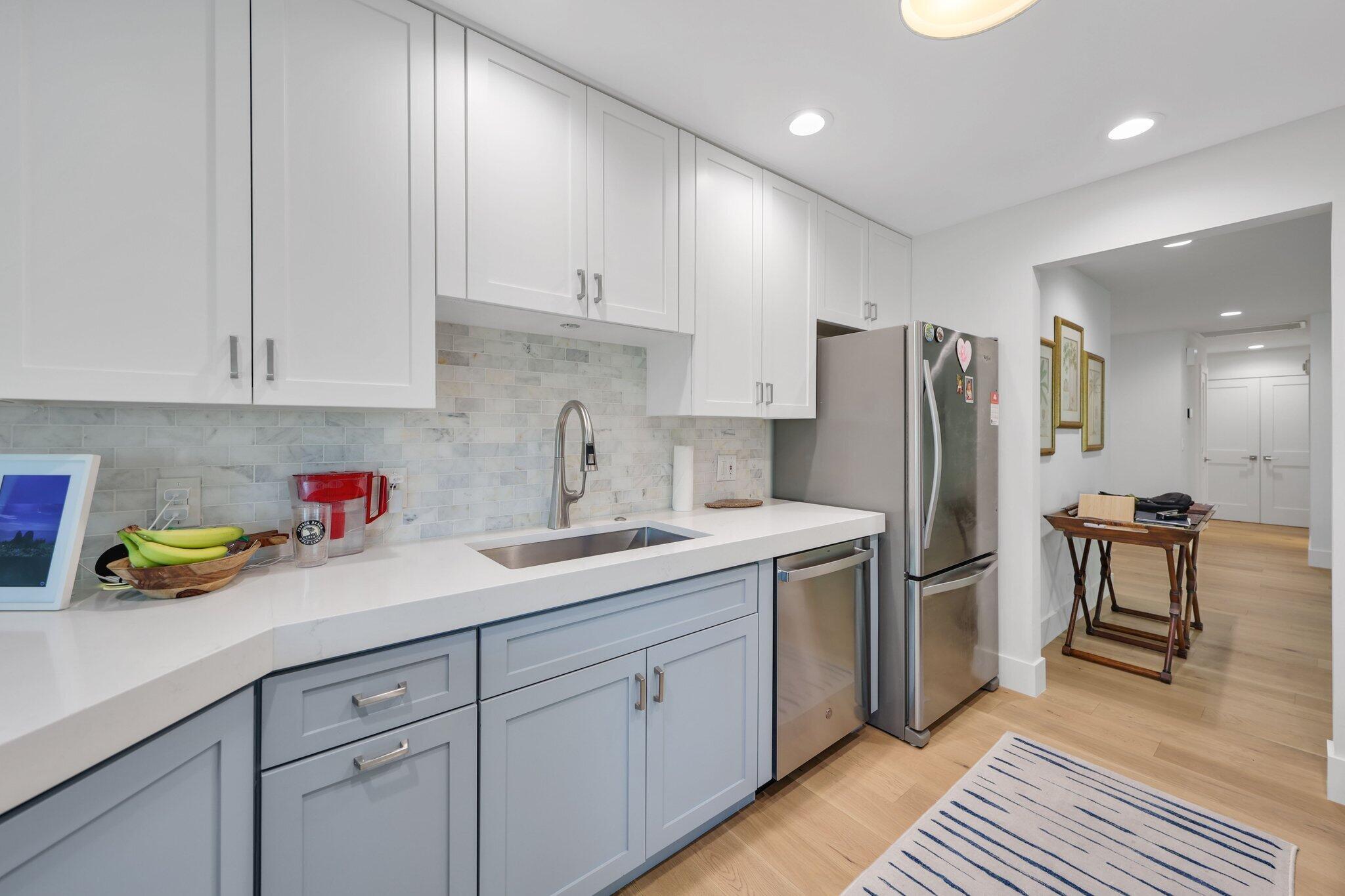 17012 Traverse Circle Jupiter, FL 33477 - Photo 11 of 33 a kitchen with a sink and refrigerator