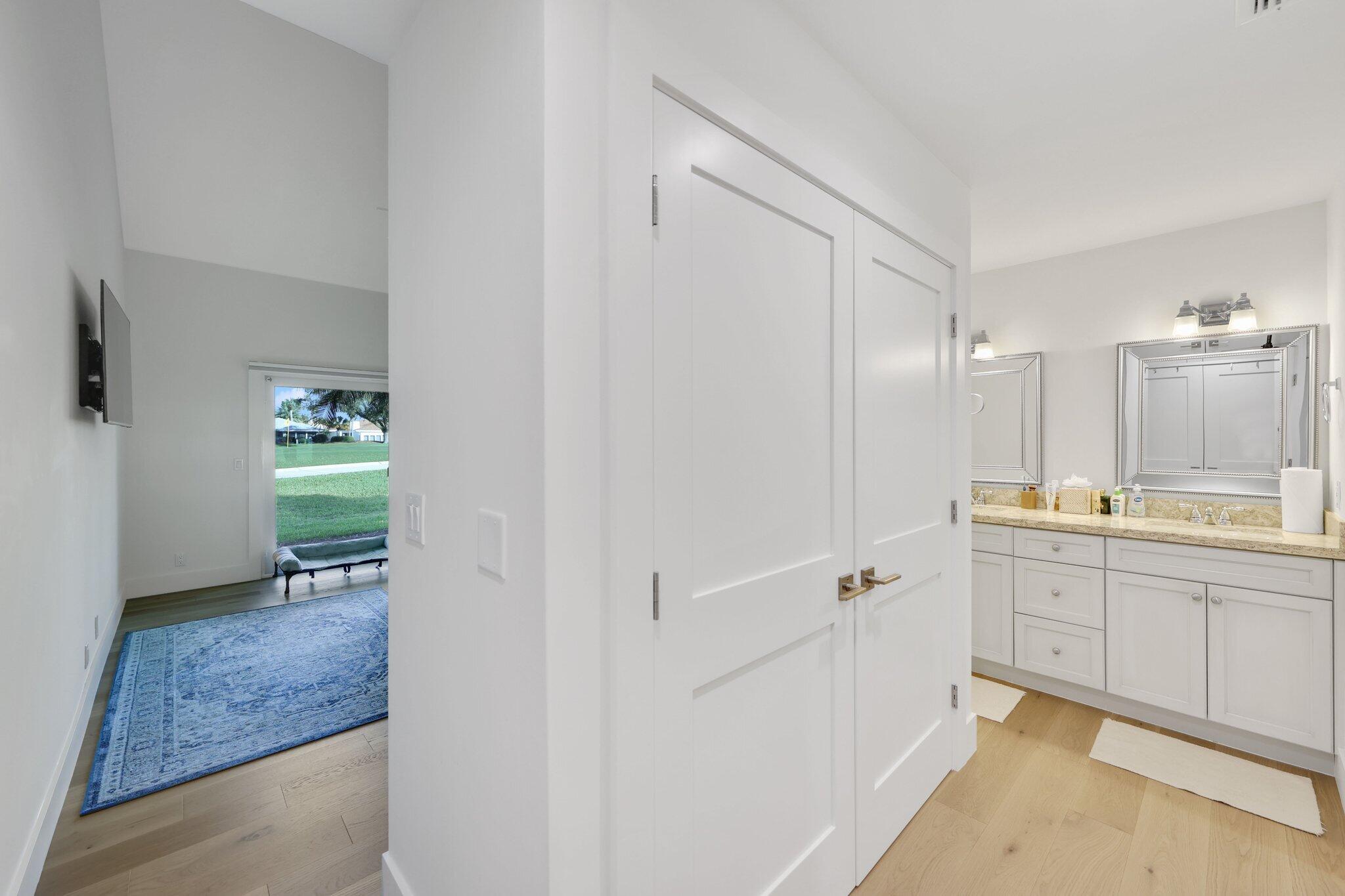 17012 Traverse Circle Jupiter, FL 33477 - Photo 22 of 33 a bathroom with a sink and a mirror