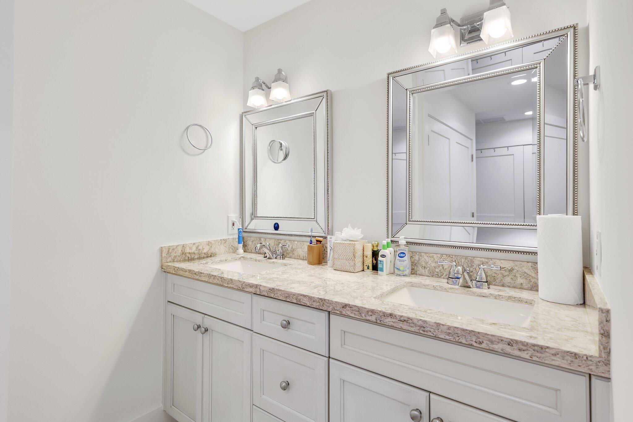 17012 Traverse Circle Jupiter, FL 33477 - Photo 23 of 33 a bathroom with double sink and a mirror