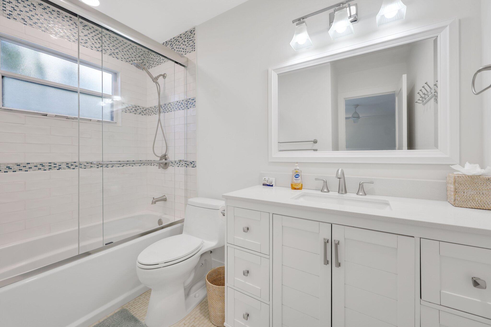 17012 Traverse Circle Jupiter, FL 33477 - Photo 28 of 33 a bathroom with a toilet a sink and shower