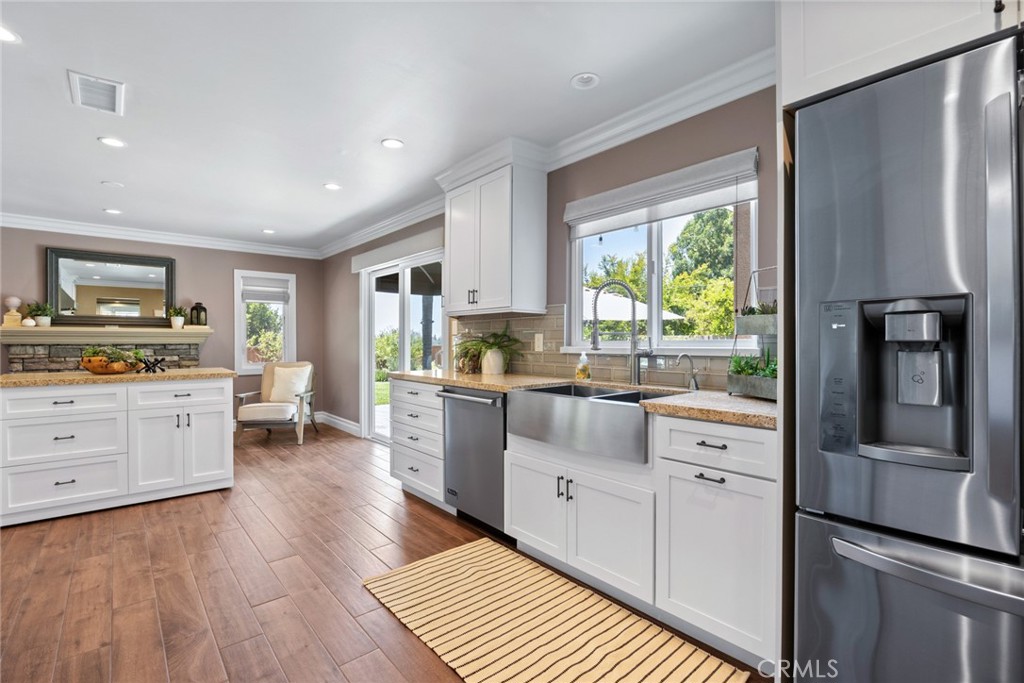 1940 Sunset Lane Fullerton, CA 92833 - Photo 17 of 50 a kitchen with stainless steel appliances sink refrigerator and window