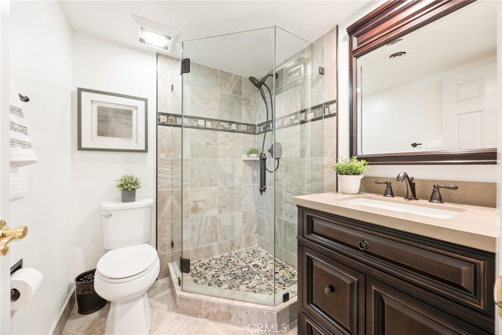 1940 Sunset Lane Fullerton, CA 92833 - Photo 21 of 50 a bathroom with a granite countertop sink toilet and shower