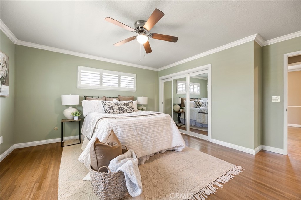 1940 Sunset Lane Fullerton, CA 92833 - Photo 23 of 50 a bedroom with a bed and wooden floor