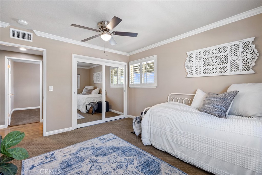 1940 Sunset Lane Fullerton, CA 92833 - Photo 29 of 50 a bedroom with a bed and a chandelier