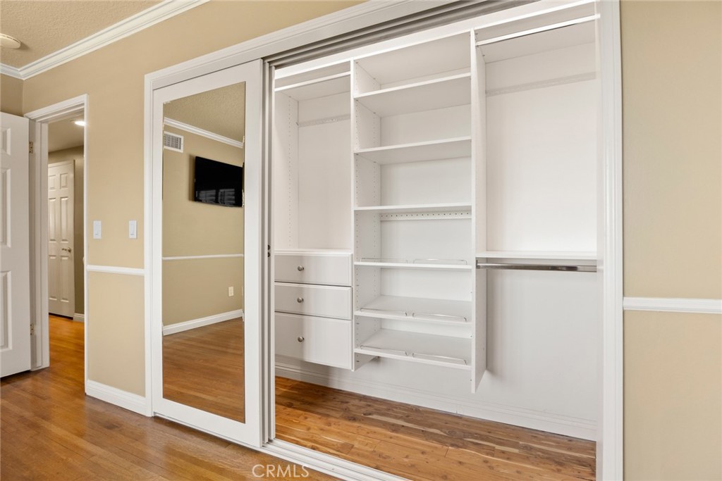 1940 Sunset Lane Fullerton, CA 92833 - Photo 33 of 50 a view of an empty walk in closet with wooden floor