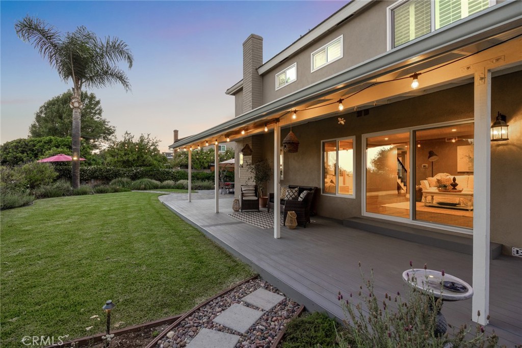 1940 Sunset Lane Fullerton, CA 92833 - Photo 41 of 50 a view of a patio with table and chairs with plants and wooden fence
