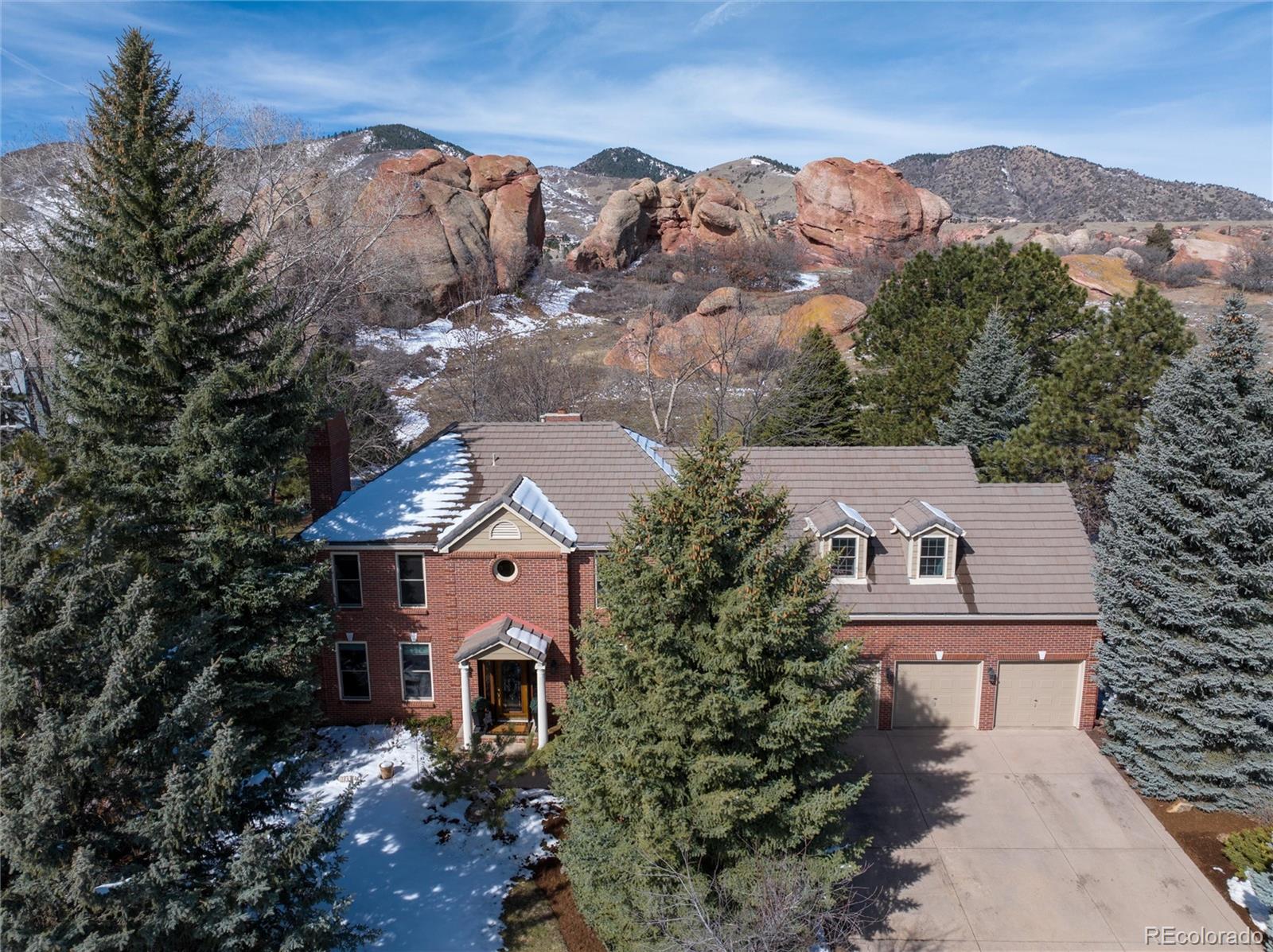 an aerial view of houses with a street
