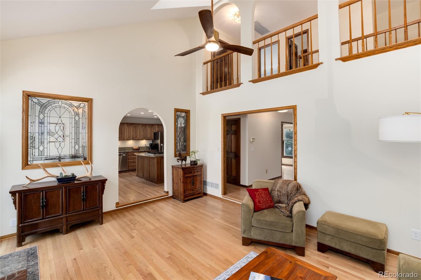 65 North Ranch Road Littleton, CO 80127 - Photo 12 of 44 a living room with furniture and wooden floor