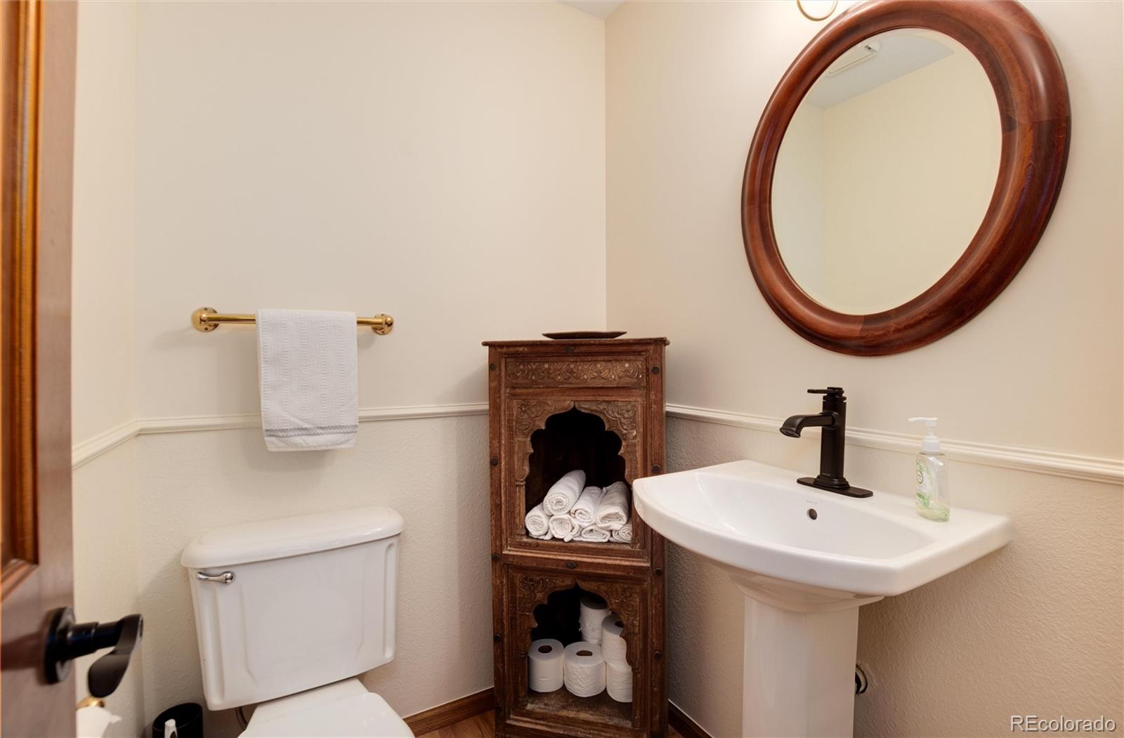 65 North Ranch Road Littleton, CO 80127 - Photo 13 of 44 a bathroom with a sink and a mirror
