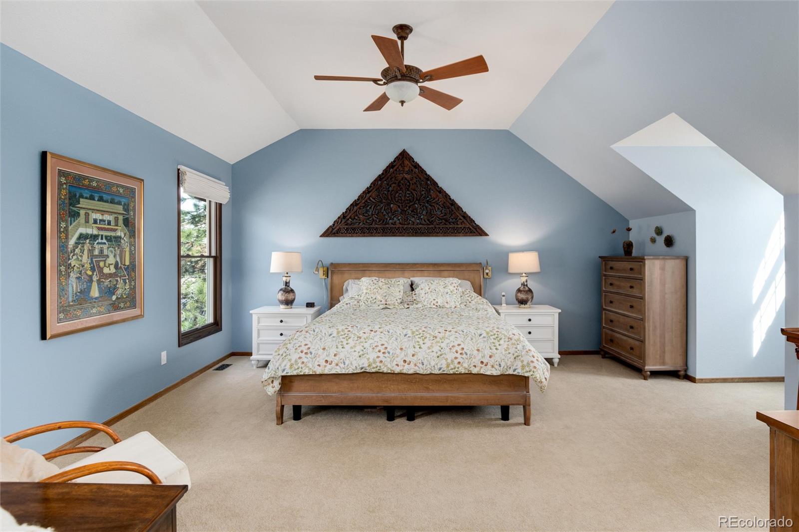 65 North Ranch Road Littleton, CO 80127 - Photo 16 of 44 a bedroom with a bed and a ceiling fan
