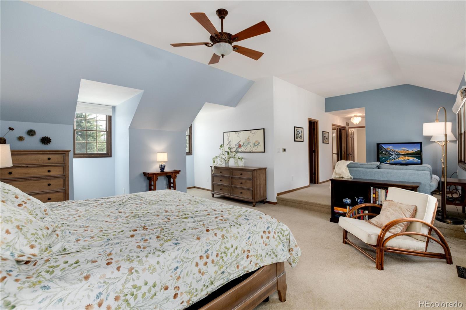 65 North Ranch Road Littleton, CO 80127 - Photo 17 of 44 a bedroom with a bed a large window and furniture