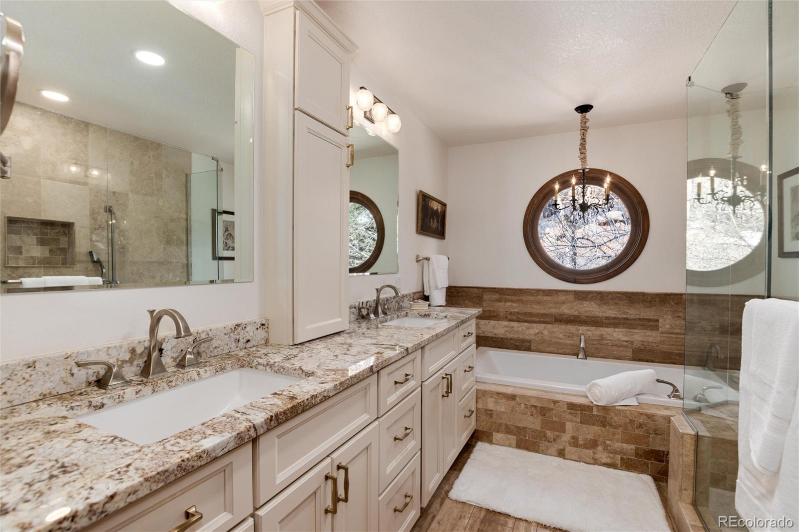 65 North Ranch Road Littleton, CO 80127 - Photo 18 of 44 a bathroom with a sink double vanity and a mirror
