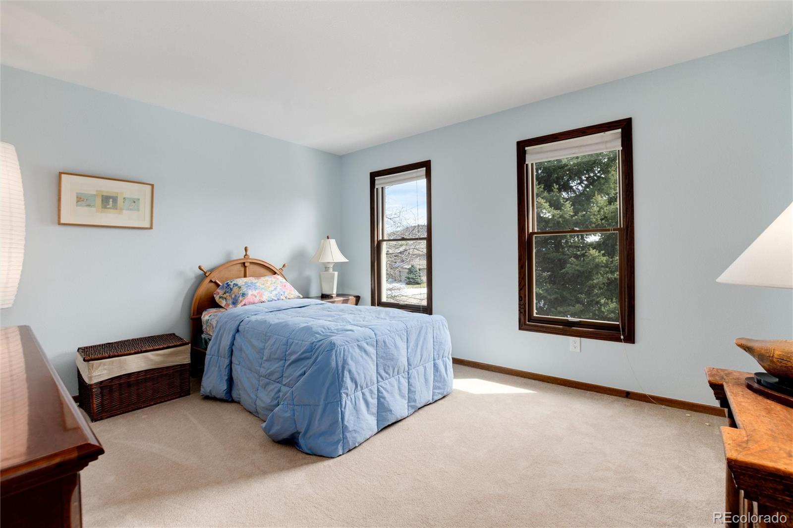 65 North Ranch Road Littleton, CO 80127 - Photo 21 of 44 a bed room with a bed and a tv
