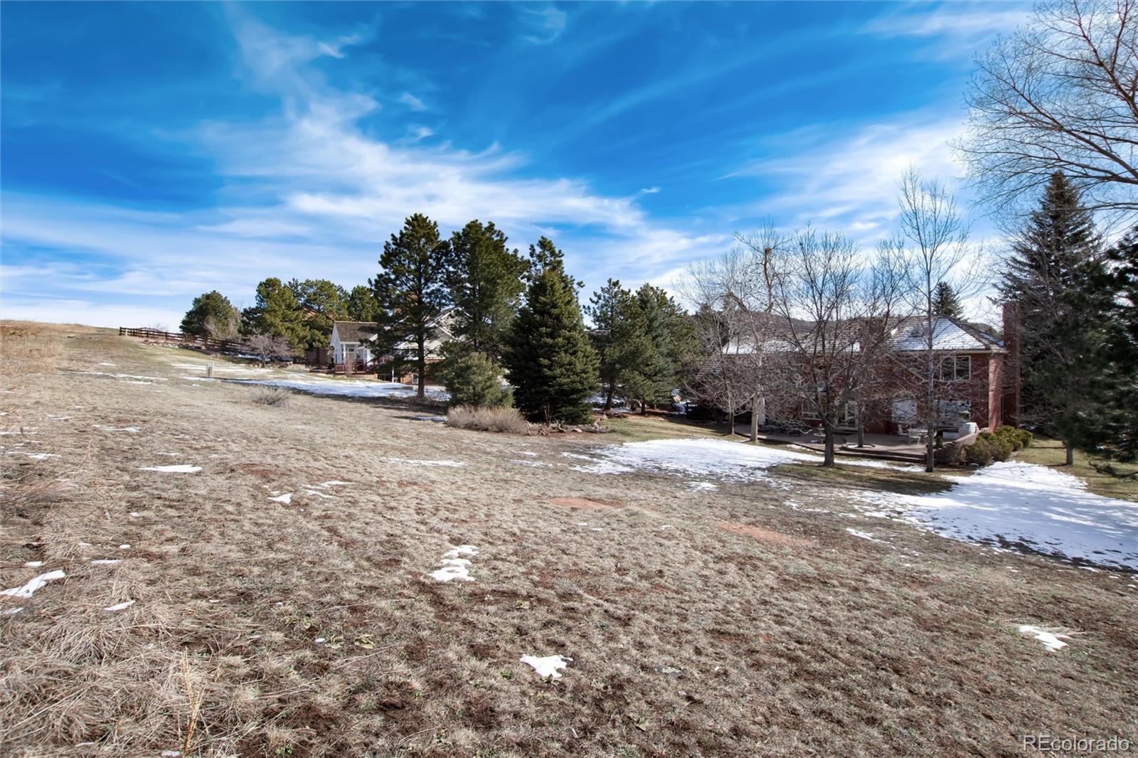 65 North Ranch Road Littleton, CO 80127 - Photo 31 of 44 a view of a road with a building in the background