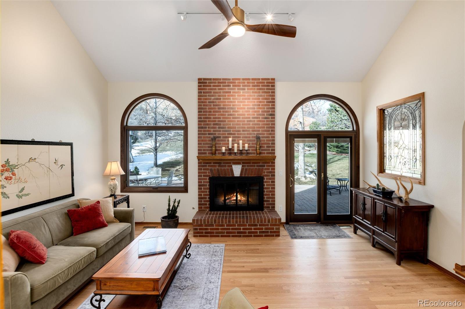 65 North Ranch Road Littleton, CO 80127 - Photo 37 of 44 a living room with furniture and a fireplace